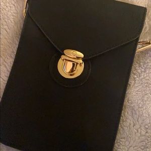 Black cross body mini purse with gold details